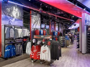 a group of people standing in front of a store