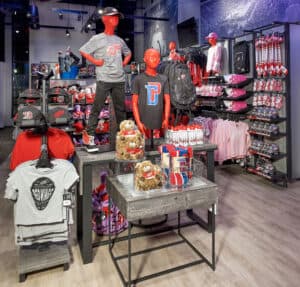 a group of people in a room with many items on display