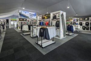 apparel racks surrounding freestanding fixture with Indianapolis 500 image