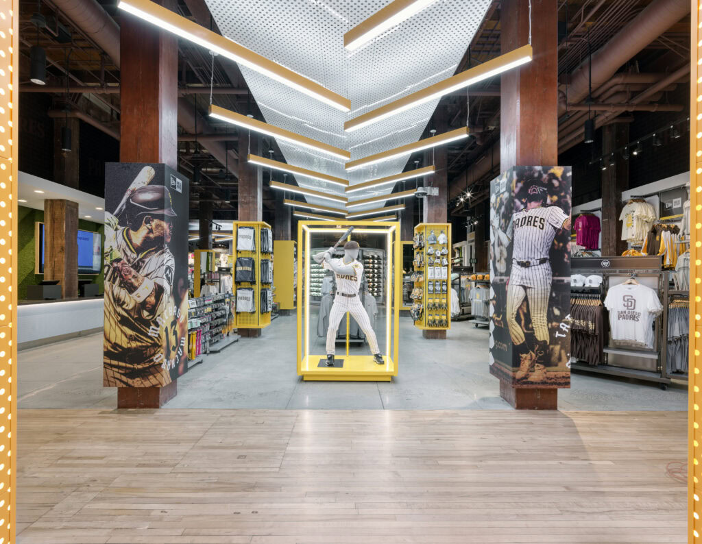wide shot of padres stadium store with baseball mannequin in center