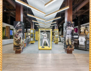 wide shot of padres stadium store with baseball mannequin in center