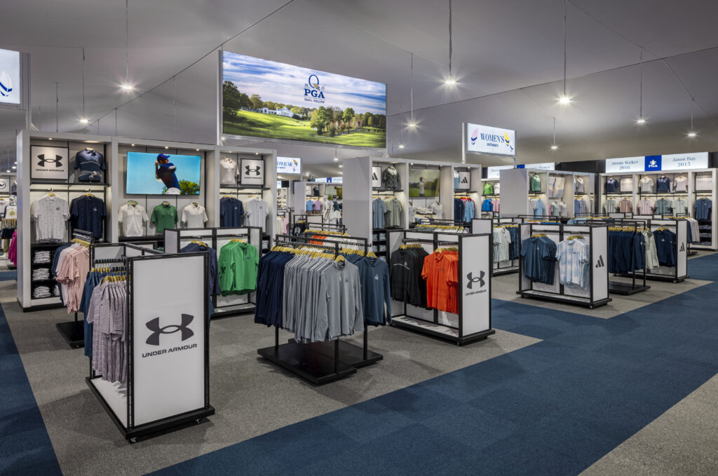 wide shot of massive retail tent with clothing racks