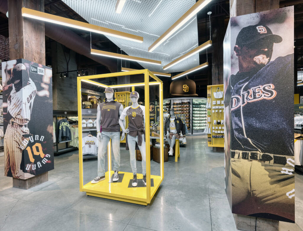 yellow mannequin stand with two padres branded fixtures