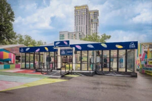Outside view of popup retail building with glass walls