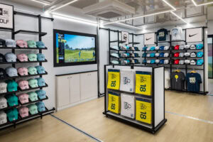 middle of popup store with tv screen on wall