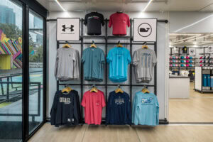 head on medium shot of shirt racks on popup store wall