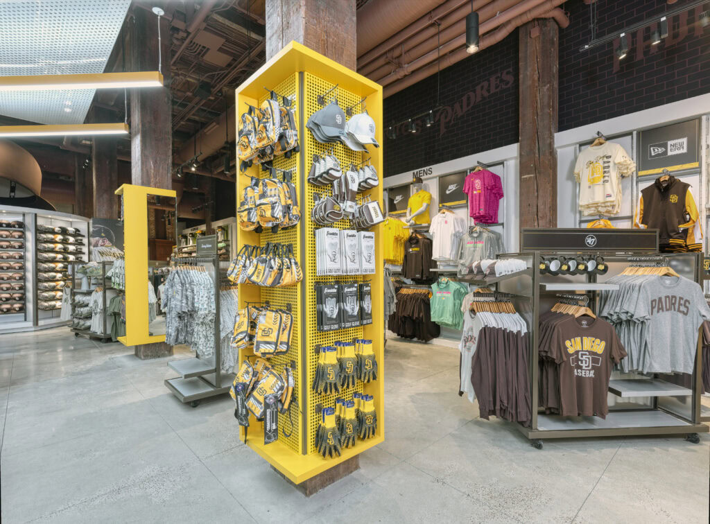 tall yellow freestanding accessory gondola with Padres merchandise