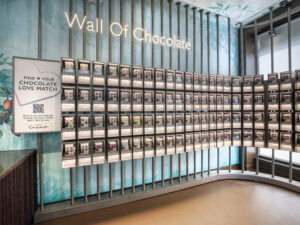 curved wall fixture featuring 108 seperate chocolate products