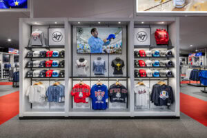 single wall floor retail unit with a selection of shirts and hats