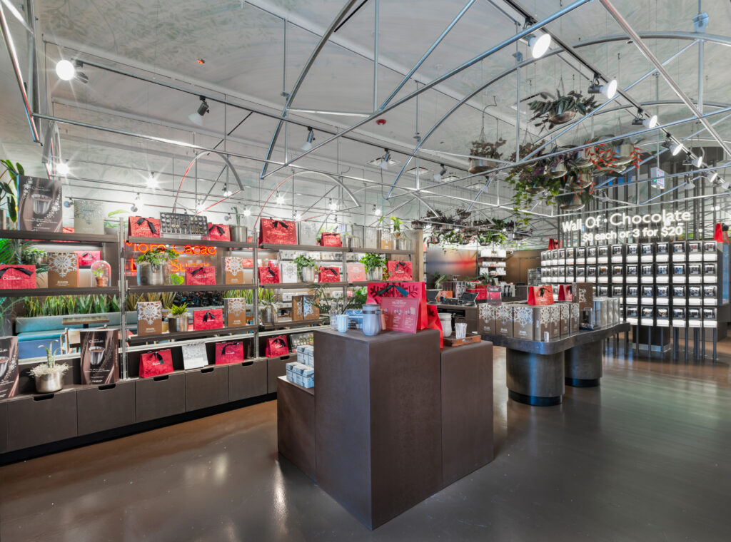 Hotel chocolat check out counter with background of shelves