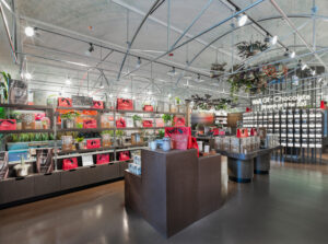 Hotel chocolat check out counter with background of shelves