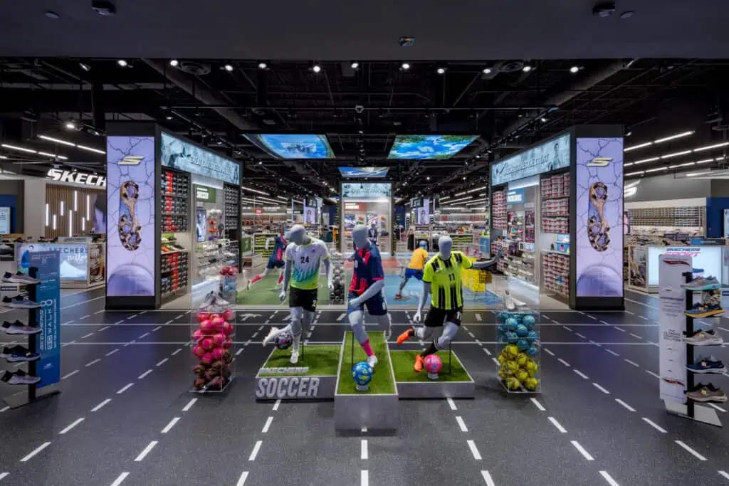 running themed floor displays on running track floor in shoe store