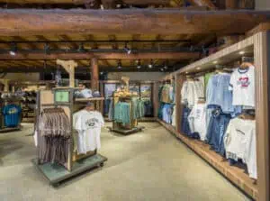 apparel racks in log cabin themed store