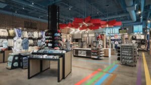 Wide shot of large room with floor fixtures and chicago merch
