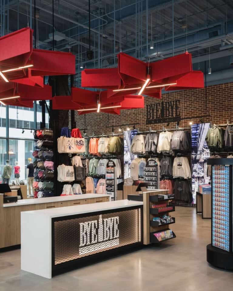 shirts and hats on center floor fixture in big room of chicago merch